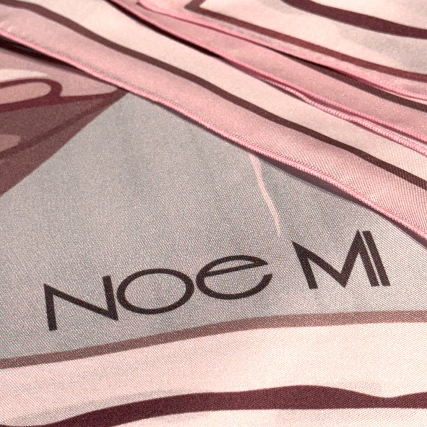 NOE MI Ginger Lace silk scarf, square accessory featuring surreal feminine design with dragonflies, flowers, and symbolic details in pink and ivory palette.
