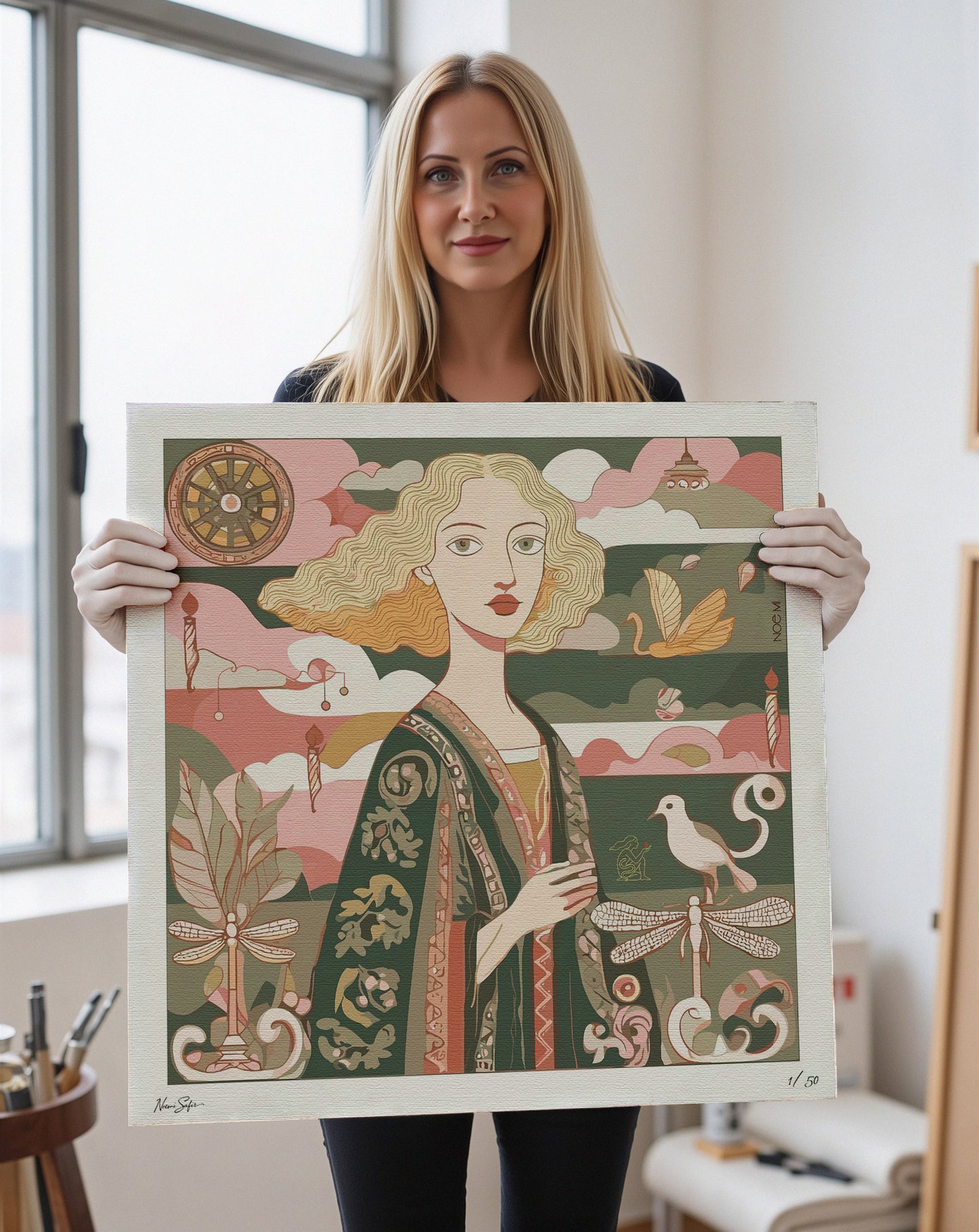 Noemi artist holding a framed artwork of a stylized portrait with decorative elements.