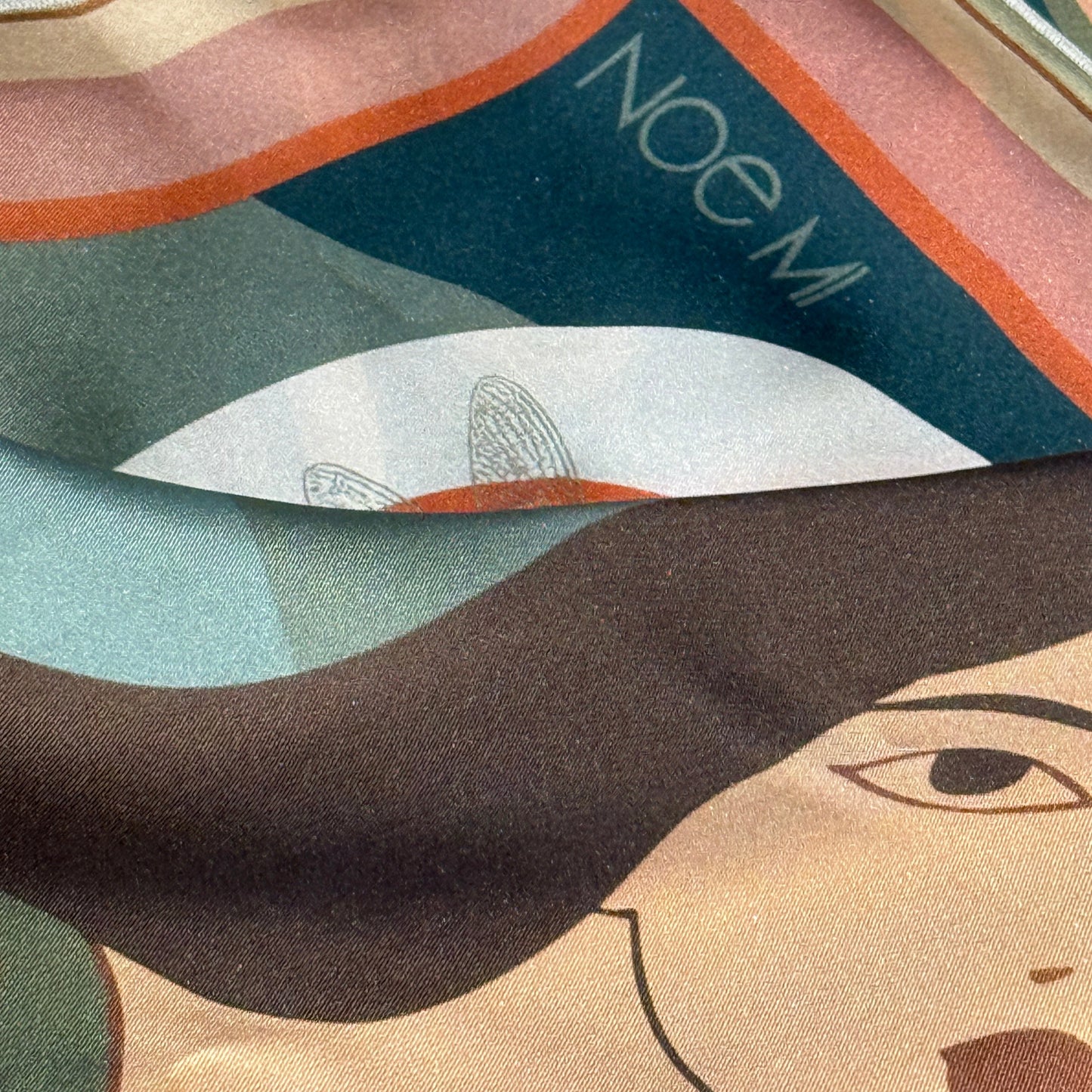 NOE MI Botanical Dreamer silk twill scarf, artistic square scarf in earthy green and coral tones with feminine surrealist illustration and symbolic motifs.