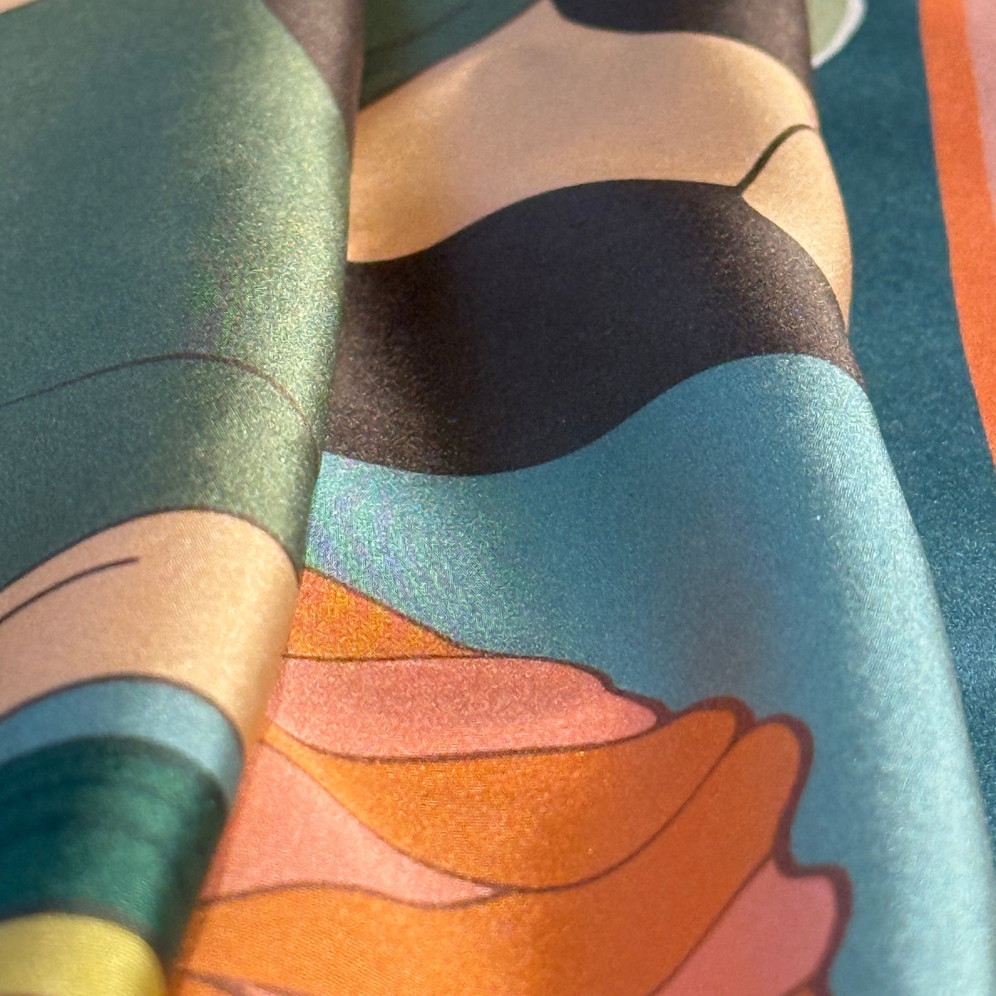 NOE MI Botanical Dreamer silk scarf, luxury square scarf in green, terracotta, and blush tones, featuring feminine surreal artwork with flowers, bird, and butterfly.
