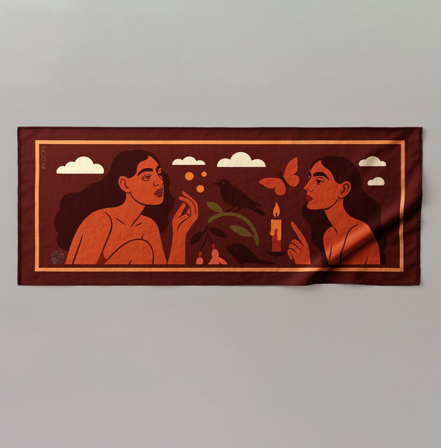 a colorful silk or chiffon pareo/sarong with artistic design of two women, a butterfly, and plants against a sky background.