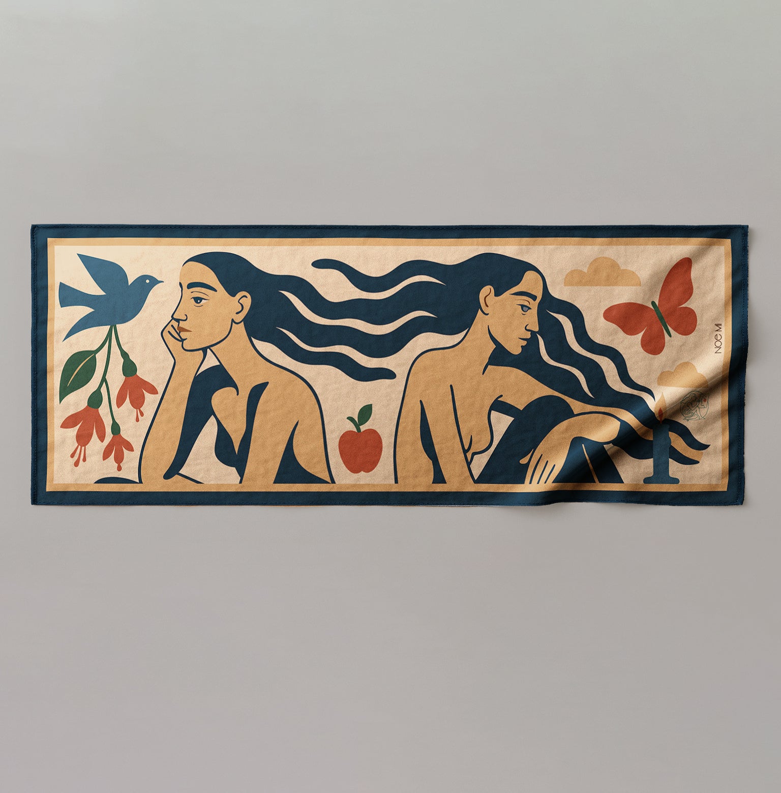a colorful silk or chiffon pareo/sarong with artistic design of two women, a bird, flower, and apple on a plain background.
