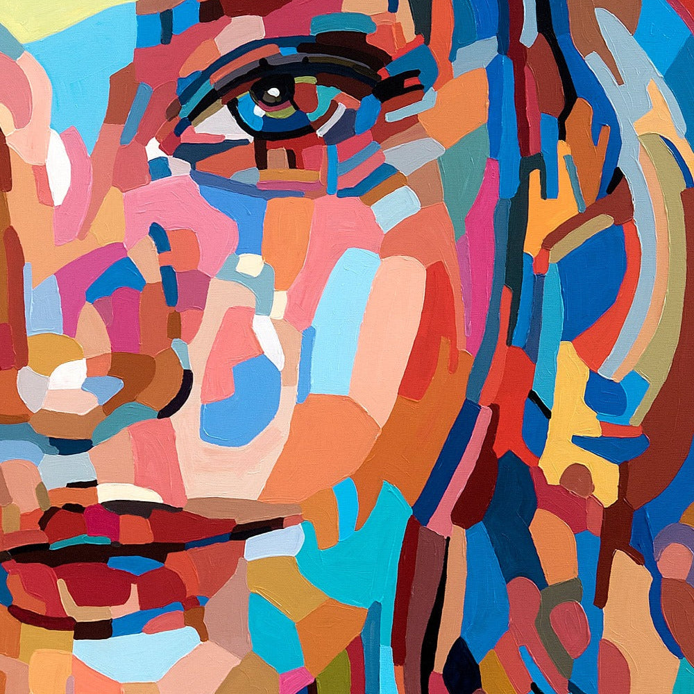 The next best thing is a limited edition art print by Noemi Safir depicting a frontal female portrait in fragmented painterly forms, combining cool blue shades with warm coral, blush, and golden accents.