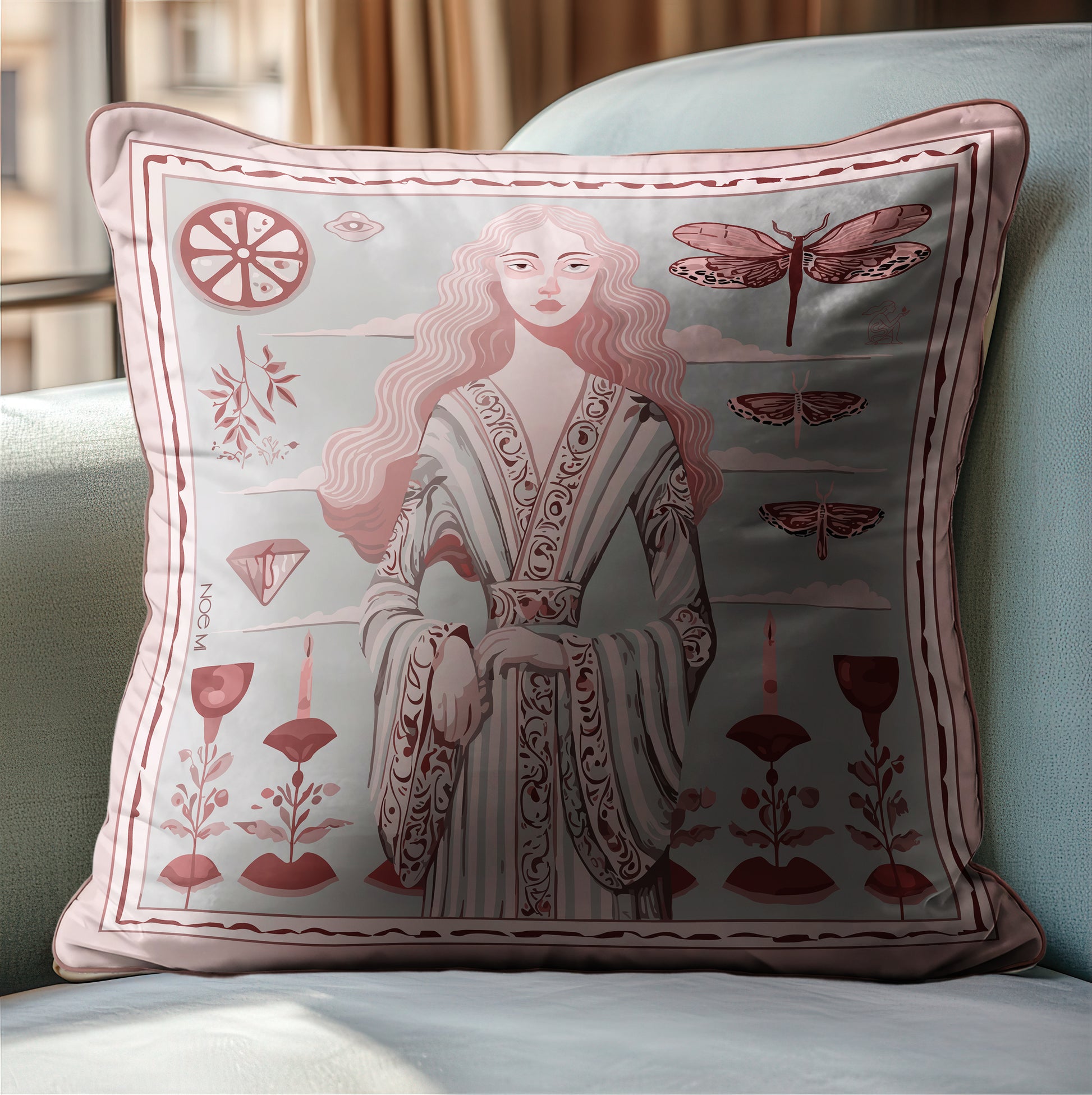 a square velvet pillow that feels as luxurious as it looks. Featuring a refined female figure surrounded by symbolic elements , The dusty rose and ivory palette adds softness to any space while the intricate details invite a closer look. designed by NOE MI