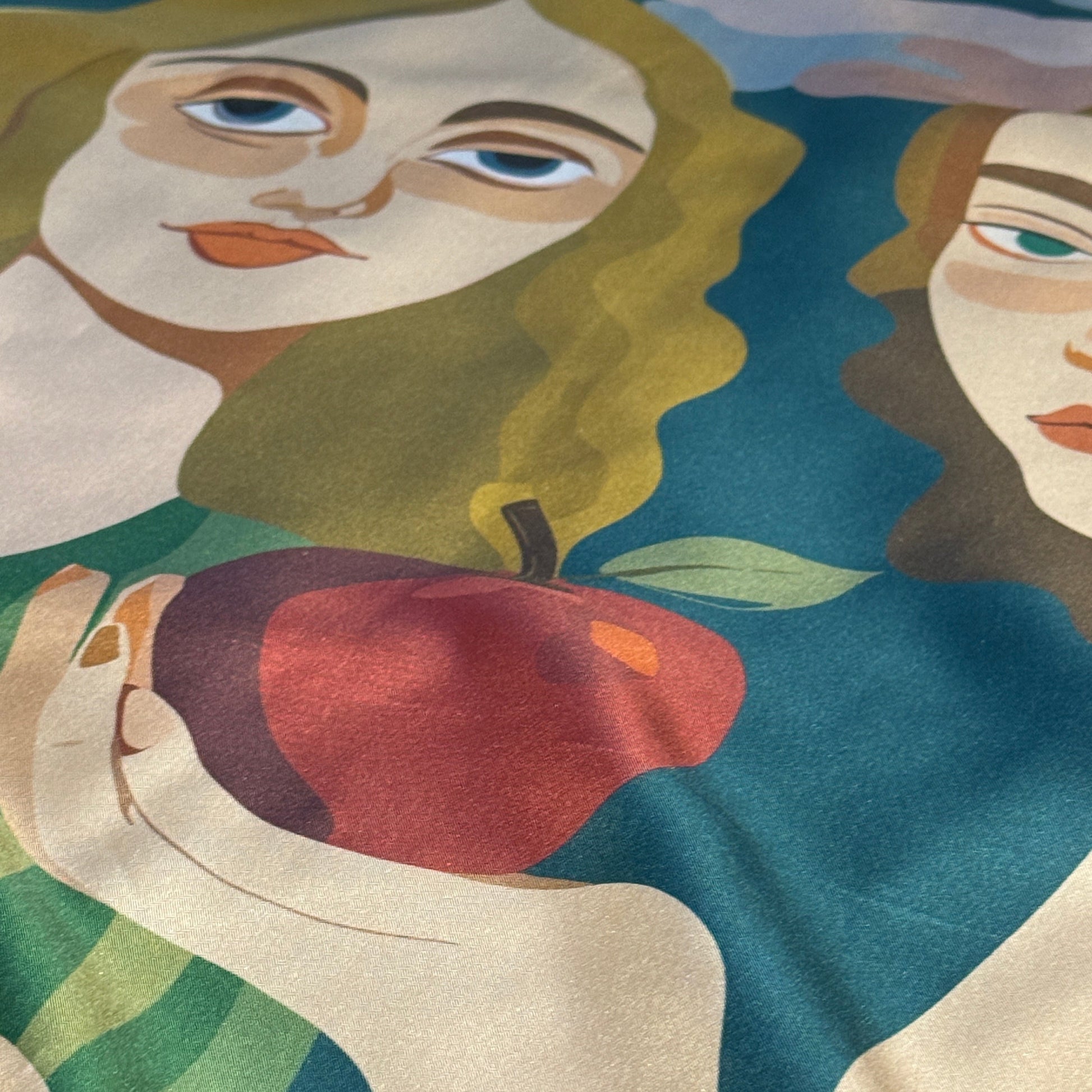 NOE MI Two of a Kind silk scarf, luxury square scarf in green, pink, and gold tones, featuring two feminine figures with apple, candle, and surreal motifs.