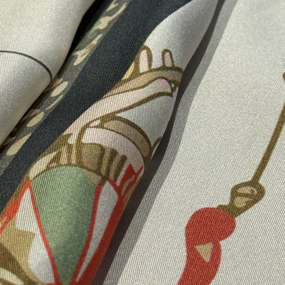 Designer silk scarf The Navigator by NOE MI, luxury square scarf with feminine surreal artwork, navigation wheel, dragonflies, and symbolic motifs.