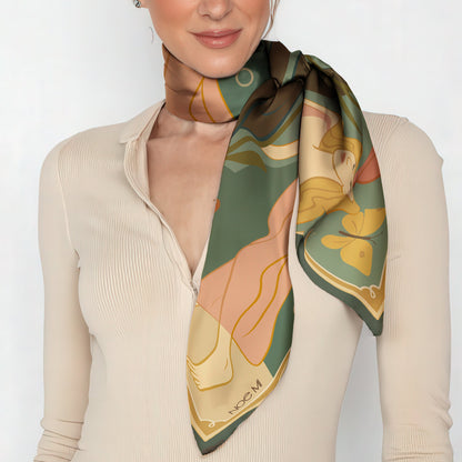 Woman wearing a patterned luxury art silk twill scarf on a white background