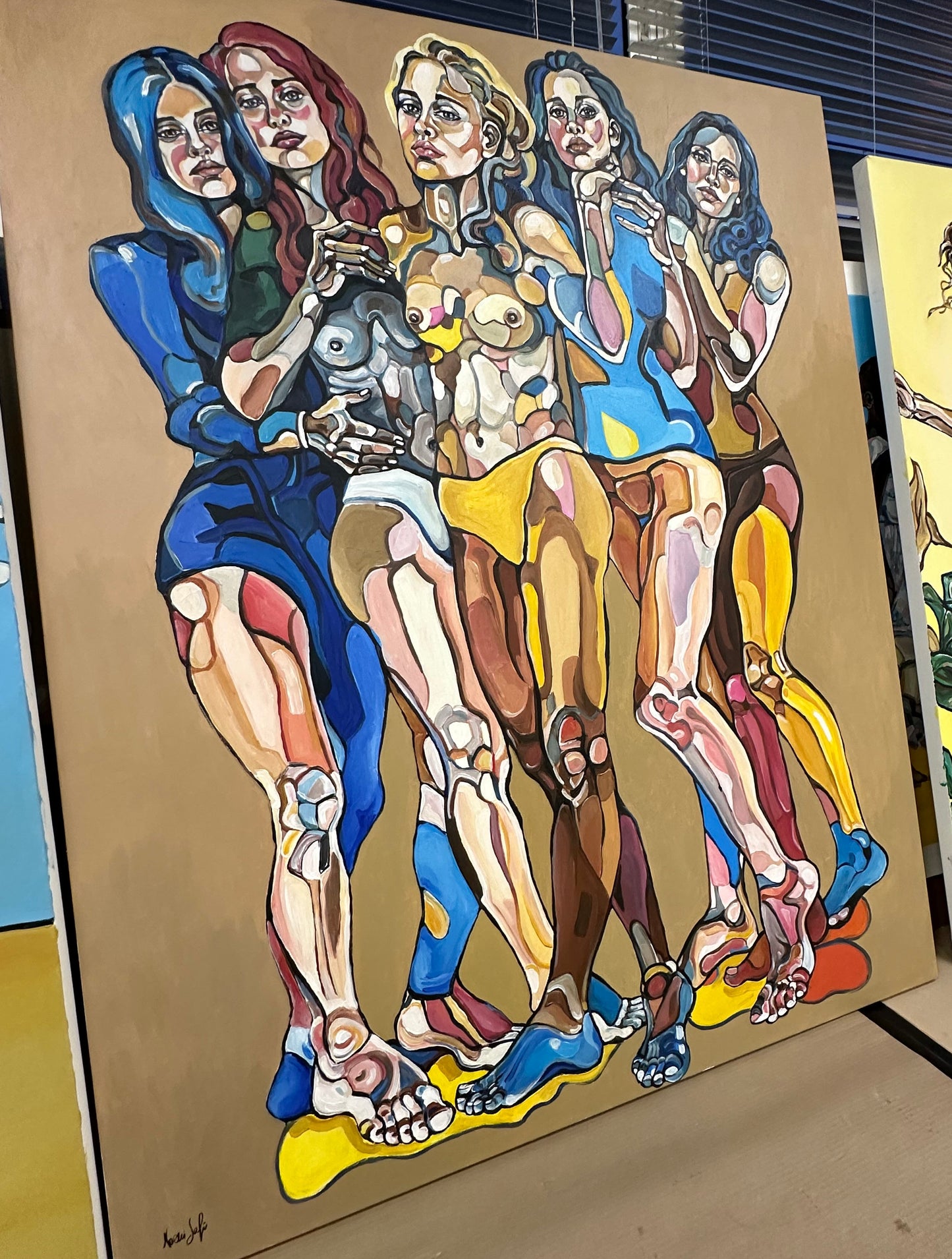 Noemi Safir large original painting We Are Unbreakable, featuring five women against a quiet beige background in a composition centered on solidarity, strength, and closeness.