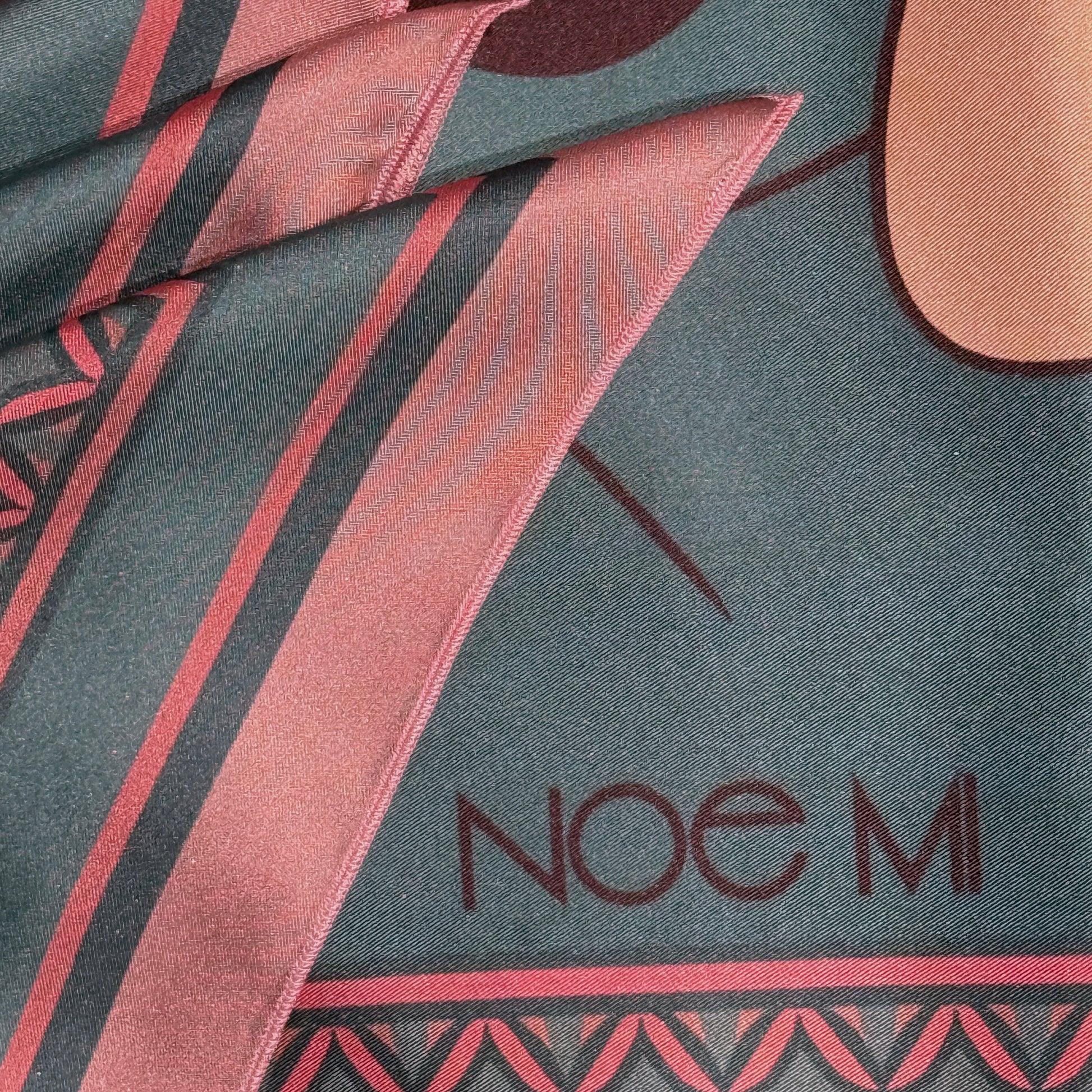 Designer silk scarf by NOE MI, Soft Chains print with surreal feminine trio, in rose and teal palette, wearable art luxury accessory.