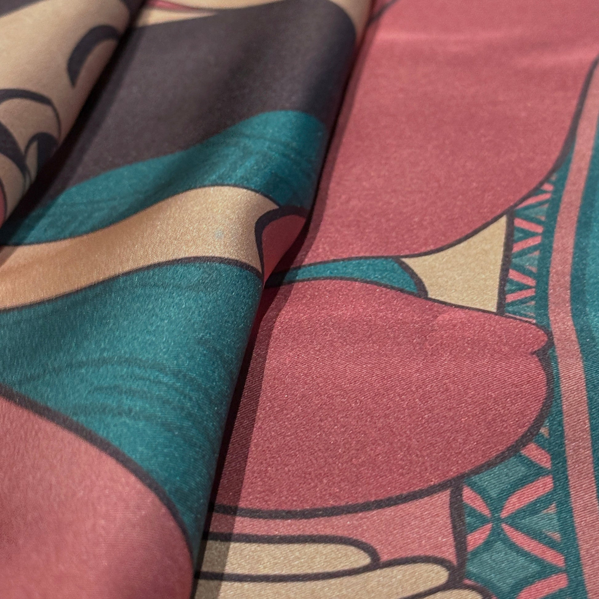 Luxury silk scarf Soft Chains by NOE MI, wearable art design in muted rose and teal colors, symbolic illustration of women with surreal storytelling motifs.