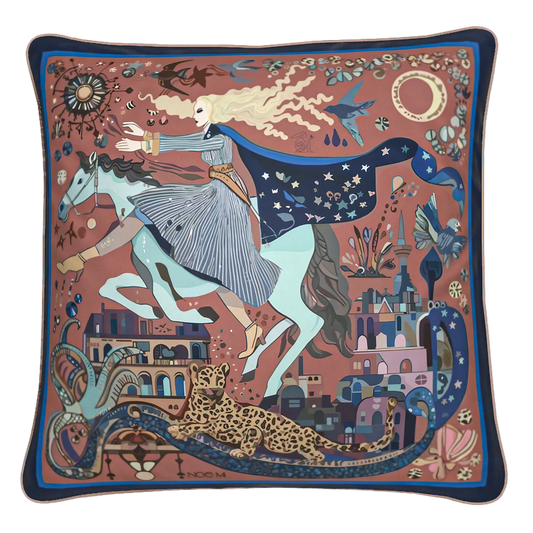 The Blue Rider square cushion by NOE MI in velvet shimmer with soft touch finish or in soft brushed twill featuring celestial rider design in terracotta, sapphire blue, and turquoise tones for luxury interiors.