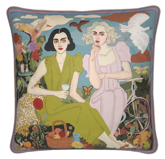 The Picnic velvet square cushion by NOE MI featuring an illustrated scene of two women enjoying a dreamy picnic. Designed to empower every space and make it unique