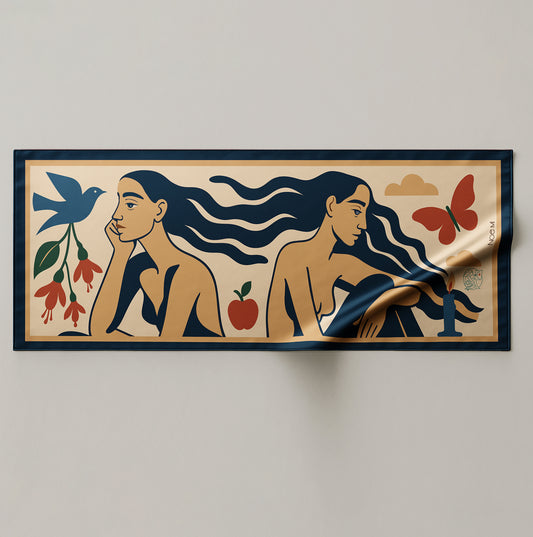 a colorful silk or chiffon pareo/sarong with artistic design of two women, birds, flowers, and an apple on a beige background.