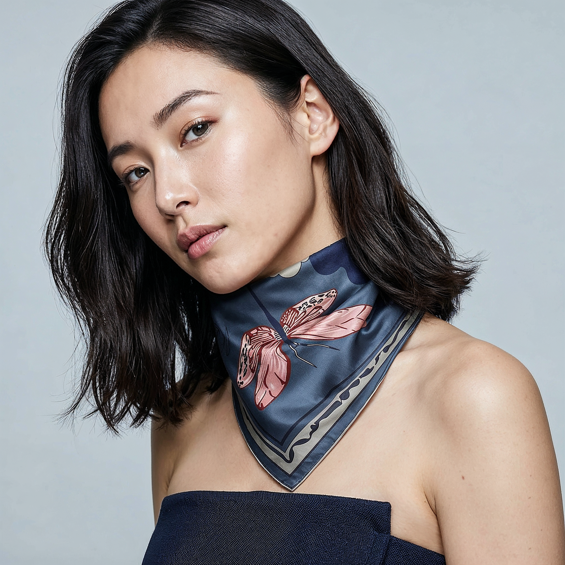 A NOE MI Silk scarf by Noemi Safir 

NOE MI Ginger Lace Indigo square silk scarf is a luxury designer scarf in deep indigo blue, terracotta, soft peach, and brown tones designed for elegant and modern styling.