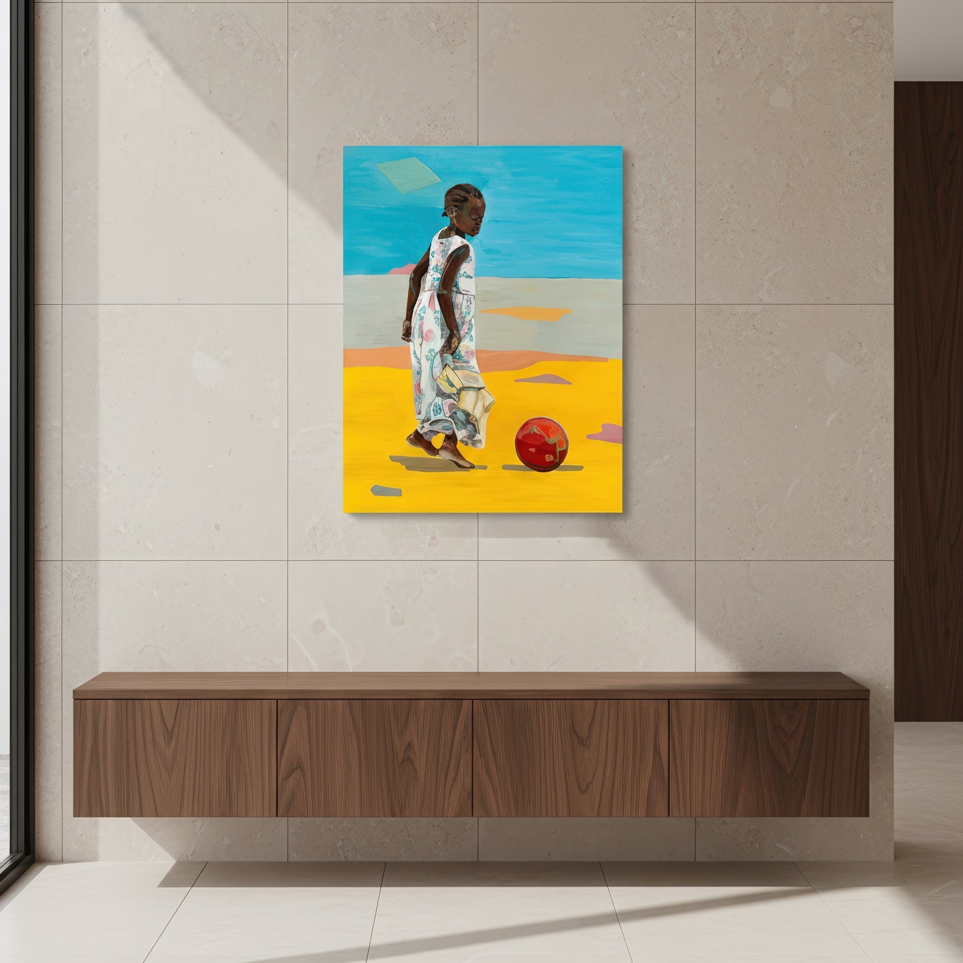 How fun it is to play outside is a limited edition art print by Noemi Safir depicting a young girl in a long pastel floral dress, captured in a calm outdoor moment with a red ball and a minimal sunlit background.