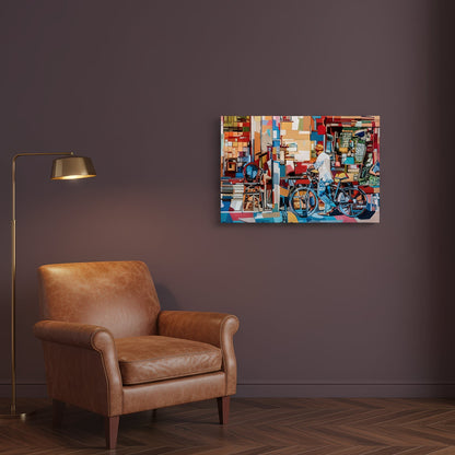 At the flea market by Noemi Safir is a limited edition fine art print featuring a man with a bicycle standing beside a richly layered storefront filled with books, furniture, and colorful urban details.